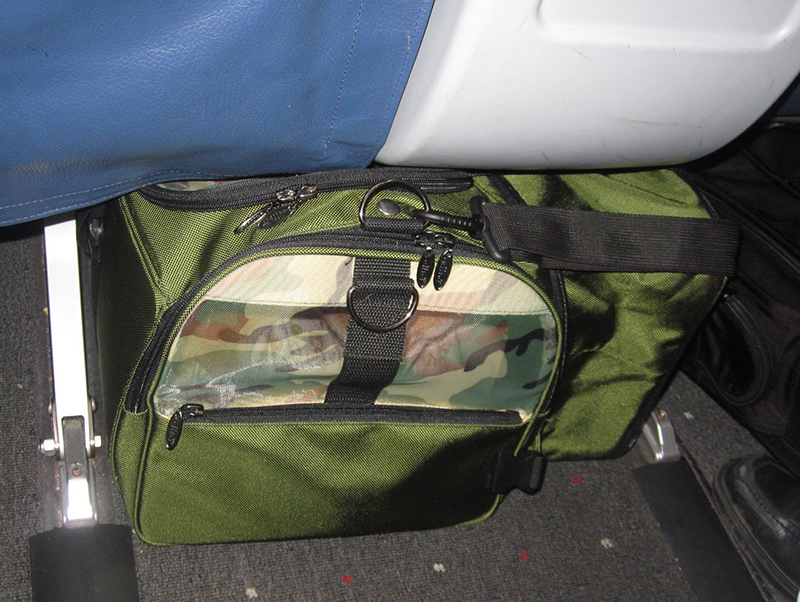 Tokyo, a Shiba Inu girl stays inside a Celltei carrier placed under an airplane seat